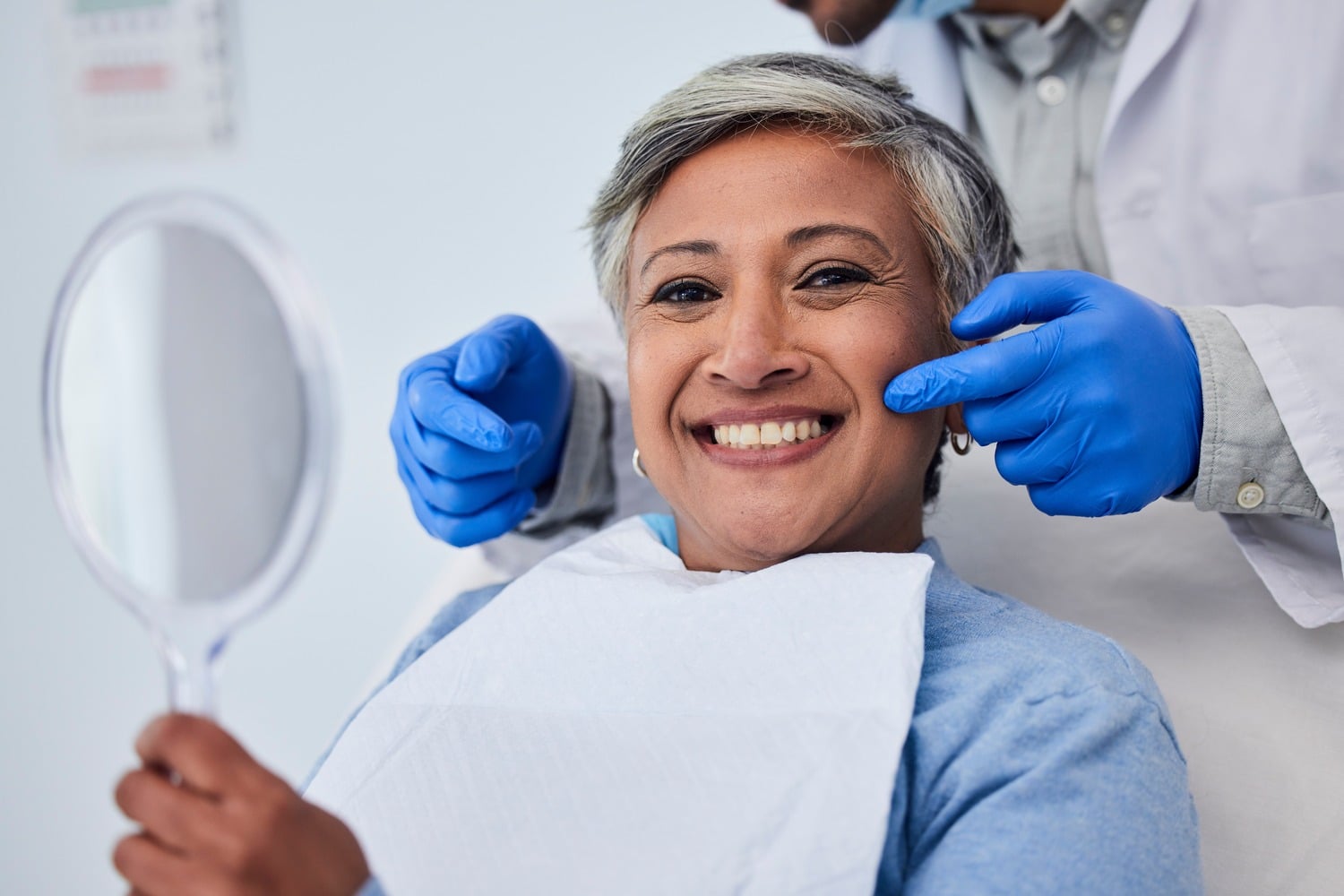 Woman smiling at her single tooth implant appointment in Castle Rock