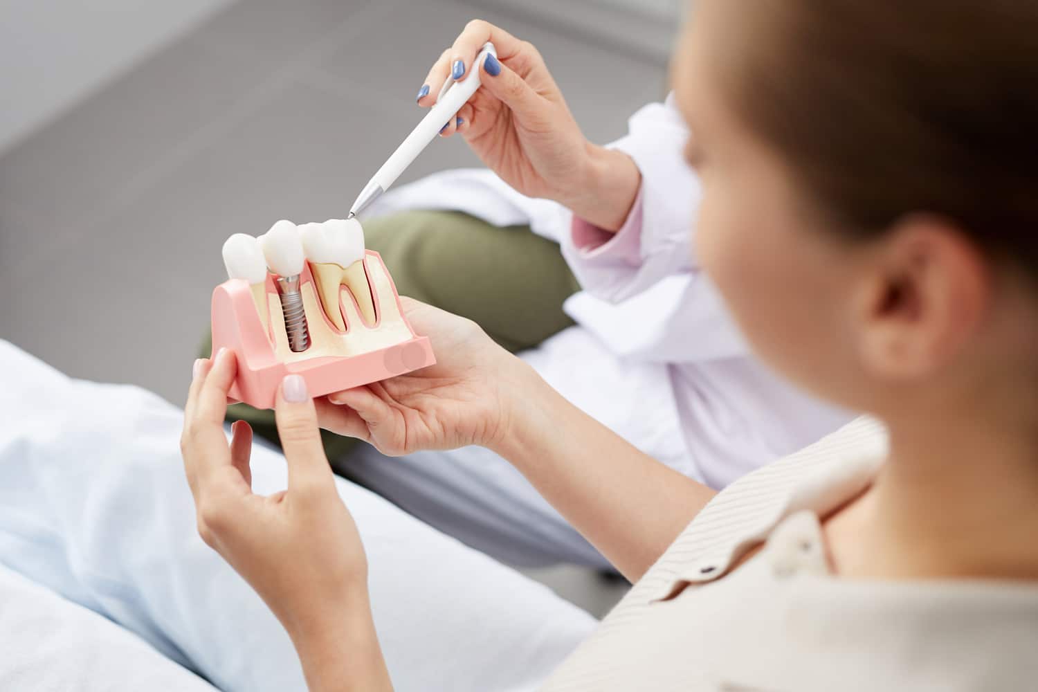 Woman dicussing all-on-x dental implants in Castle Pines CO